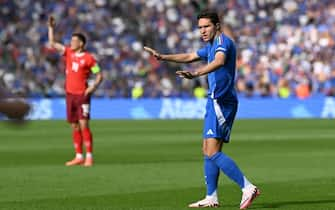 Italy's forward #14 Federico Chiesa gestures during the UEFA Euro 2024 round of 16 football match between Switzerland and Italy at the Olympiastadion Berlin in Berlin on June 29, 2024. (Photo by Kirill KUDRYAVTSEV / AFP)