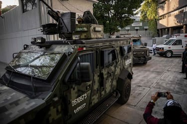 Aarmoured vehicles leave the Attorney General's Office for Special Investigations on Organized Crime (FEMDO) in Mexico City, on January 5, 2023, after the arrest of Ovidio Guzman, son of imprisoned drug trafficker Joaquin "El Chapo" Guzman. - Mexican security forces on Thursday captured a son of jailed drug kingpin Joaquin "El Chapo" Guzman, scoring a high-profile win in the fight against powerful cartels days before US President Joe Biden visits. Ovidio Guzman, who was arrested in the northwestern city of Culiacan, is accused of leading a faction of his father's notorious Sinaloa cartel, Defense Minister Luis Cresencio Sandoval told reporters. (Photo by NICOLAS ASFOURI / AFP) (Photo by NICOLAS ASFOURI/AFP via Getty Images)