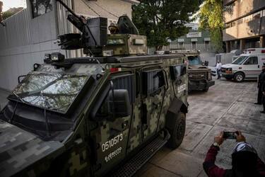 Aarmoured vehicles leave the Attorney General's Office for Special Investigations on Organized Crime (FEMDO) in Mexico City, on January 5, 2023, after the arrest of Ovidio Guzman, son of imprisoned drug trafficker Joaquin "El Chapo" Guzman. - Mexican security forces on Thursday captured a son of jailed drug kingpin Joaquin "El Chapo" Guzman, scoring a high-profile win in the fight against powerful cartels days before US President Joe Biden visits. Ovidio Guzman, who was arrested in the northwestern city of Culiacan, is accused of leading a faction of his father's notorious Sinaloa cartel, Defense Minister Luis Cresencio Sandoval told reporters. (Photo by NICOLAS ASFOURI / AFP) (Photo by NICOLAS ASFOURI/AFP via Getty Images)