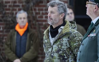 epa11003295 Denmark's Crown Prince Frederik (C) wears a hunter's camouflage outfit as he meets the members of a hunting party in Klosterheden Plantage, Denmark, 30 November 2023. The Danish heir to the throne host a 'Royal Hunt' in Klosterheden Plantage between Struer and Lemvig in Denmark's Jutland region.  EPA/Mikkel Berg Pedersen  DENMARK OUT
