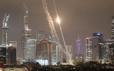 epaselect epa12176279 Israel's Iron Dome air defense system intercepts ballistic missiles fired from Iran over the city of Tel Aviv, Israel, 15 June 2025. Israel's military identified the missiles as being launched from Iran toward Israeli territory in retaliation for overnight airstrikes on Iranian targets.  EPA/ATEF SAFADI