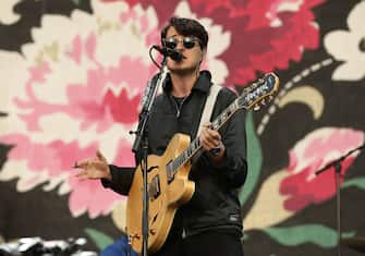 Ezra Koenig of Vampire Weekend performing on the Main Stage, at the Reading Festival, at Little John's Farm on Richfield Avenue, Reading.