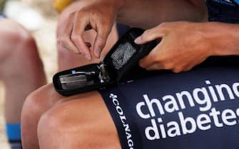 epa08220523 British cyclist Samuel Brand of team Novo Nordisk takes a blood sugar test before going out to competition in Paipa, Boyaca, Colombia, 14 February 2020 (Issued 15 February 2020). The Swiss Oliver Behringer, the British Samuel Brand, the Finnish Joonas Henttala, the Spanish David Lozano, the Italian Andrea Peron, and the Uzbek Ulugbek Sidov represent the Novo Nordisk team in the Tour Colombia with a message that diabetes is no impediment to be a professional cyclist.  EPA/Mauricio Duenas Castaneda