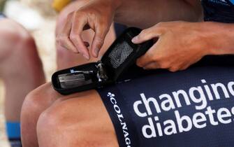 epa08220523 British cyclist Samuel Brand of team Novo Nordisk takes a blood sugar test before going out to competition in Paipa, Boyaca, Colombia, 14 February 2020 (Issued 15 February 2020). The Swiss Oliver Behringer, the British Samuel Brand, the Finnish Joonas Henttala, the Spanish David Lozano, the Italian Andrea Peron, and the Uzbek Ulugbek Sidov represent the Novo Nordisk team in the Tour Colombia with a message that diabetes is no impediment to be a professional cyclist.  EPA/Mauricio Duenas Castaneda