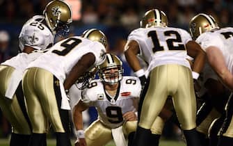 MIAMI GARDENS, FL - FEBRUARY 07: Quarterback Drew Brees #9 of the New Orleans Saints huddles with his team against the Indianapolis Colts during Super Bowl XLIV on February 7, 2010 at Sun Life Stadium in Miami Gardens, Florida.  (Photo by Donald Miralle/Getty Images)