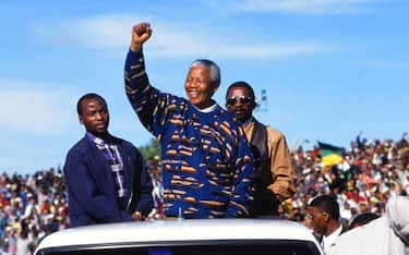 Nelson Mandela (center) campaigns during the first democratic election, Cape Town, South Africa, 1995. (Photo by Susan Winters Cook/Getty Images)