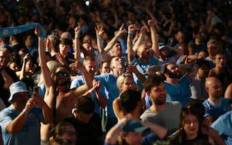 epa10684405 Manchester City fans celebrate winning the UEFA Champions League final between Manchester City and Inter Milan at the 4TheFans fan park in Manchester, Britain, 10 June 2023.  EPA/ADAM VAUGHAN