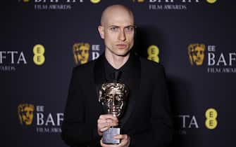 epa11901544 Daniel Blumberg poses in the press room after winning award for Original Score for 'The Brutalist' during the BAFTA Film Awards at the Royal Festival Hall in London, Britain, 16 February 2025. The ceremony is hosted by the British Academy of Film and Television Arts (BAFTA).  EPA/TOLGA AKMEN