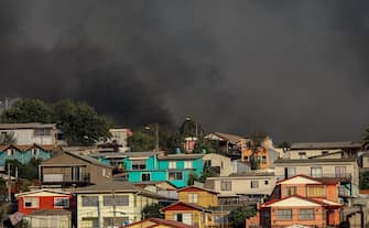 VINA DEL MAR, CHILE - FEBRUARY 3: Smoke rises over the forest during a wildfire in the Vina del Mar, Chile, on February 3, 2024.Thousands of homes damaged after wildfire affected Chile's Vina del Mar hills. According to authorities, the fire has destroyed more than 1,000 homes and left at least 20 dead. (Photo by Lucas Aguayo Araos/Anadolu via Getty Images)