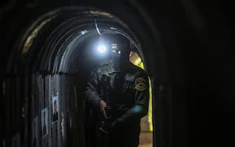 18 May 2022, Palestinian Territories, Beit Hanoun: A member of Saraya al-Quds, the military wing of the Islamic Jihad movement in Palestine, takes a position inside a military tunnel near the "Sword of Jerusalem" festival in Beit Hanoun in the northern Gaza Strip, which celebrate the first anniversary of the war on Gaza. Photo: Mohammed Talatene/dpa (Photo by Mohammed Talatene/picture alliance via Getty Images)