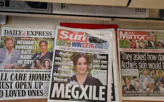 epa09061809 British newspapers on a stand after the US television interview by Oprah Winfrey of Britain's Prince Harry and Meghan Markle, the Duke and Duchess of Sussex in London, Britain, 08 March 2021. ITV will air the interview to the United Kingdom tonight at 9pm.  EPA/FACUNDO ARRIZABALAGA