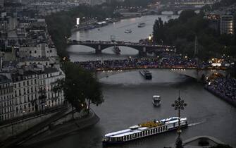 A boat with the Belgium's delegation sails on the river Seine during the opening ceremony of the Paris 2024 Olympic Games in Paris on July 26, 2024. (Photo by JULIEN DE ROSA / POOL / AFP) (Photo by JULIEN DE ROSA/POOL/AFP via Getty Images)