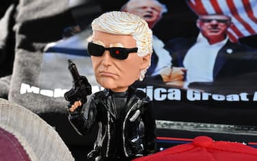 Tee shirts, hats and memorabilia supporter US President Donald Trump is for sale by a vendor who regularly sets up a street stand next to Donald Trump's star on the Hollywood Walk of Fame on January 20, 2025 as Trump's inauguration as the 47th US president. (Photo by Robyn Beck / AFP)