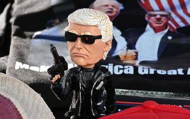 Tee shirts, hats and memorabilia supporter US President Donald Trump is for sale by a vendor who regularly sets up a street stand next to Donald Trump's star on the Hollywood Walk of Fame on January 20, 2025 as Trump's inauguration as the 47th US president. (Photo by Robyn Beck / AFP)