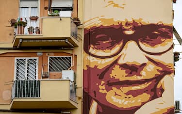 A mural dedicated to Italian composer, orchestrator, conductor, Ennio Morricone, on a popular building facade in Lorenzo Lotto square in Rome, 10 November 2022. Ennio Morricone died on the 20th July of 2020. ANSA/MASSIMO PERCOSSI