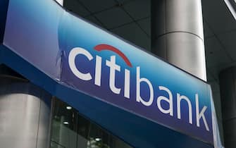 epa09139017 A sign with the Citibank logo in Singapore,  16 April 2021. American bank Citigroup announced today that it will close its consumer banking operations in 13 markets across Asia, Europe, and the Middle East. It will retain its hubs in Singapore, Hong Kong, London, and the United Arab Emirates citing that it 'does not have the scale' to compete across the various countries.  EPA/WALLACE WOON