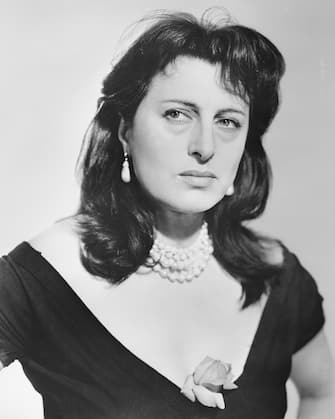 (Original Caption) 3/21/1956-Hollywood, CA: Italy's fiery Anna Magnani was named the best actress of 1955 tonight for her role in "The Rose Tattoo" at the 28th Annual Acedemy Awards Ceremony in Hollywood. Miss Magnani is in Italy with her Ailing son and the award was accepted for her by actress Marisa Pavan, an unsuccessful nominee for best supporting actress for her role in the same picture.