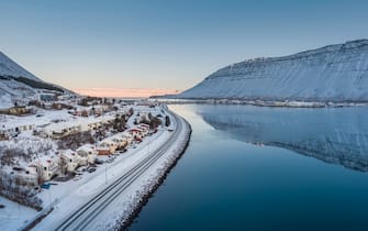 Isafjordur situated in the Westfjords of Iceland is known for dramatic landscapes and the largest population in the area. This image is shot using a drone.