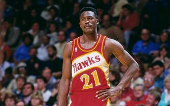 ATLANTA - 1990: Dominique Wilkins #21 of the Atlanta Hawks stands during a game played circa 1990 at the Omni  in Atlanta, Georgia. NOTE TO USER: User expressly acknowledges and agrees that, by downloading and or using this photograph, User is consenting to the terms and conditions of the Getty Images License Agreement. Mandatory Copyright Notice: Copyright 1990 NBAE (Photo by Scott Cunningham/NBAE via Getty Images)