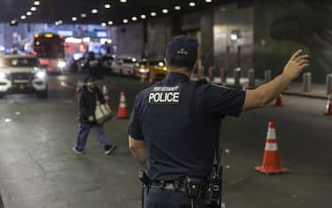 Police direct a bus carrying migrants arriving from Del Rio, Texas, at the Port Authority Bus Terminal in New York, US, on Saturday, May 13, 2023. New York and other major cities are gearing up for an anticipated surge of migrants following the end of Title 42, a Trump-era policy that allowed the US to quickly expel migrants at the border because of the pandemic. Photographer: Victor J. Blue/Bloomberg via Getty Images