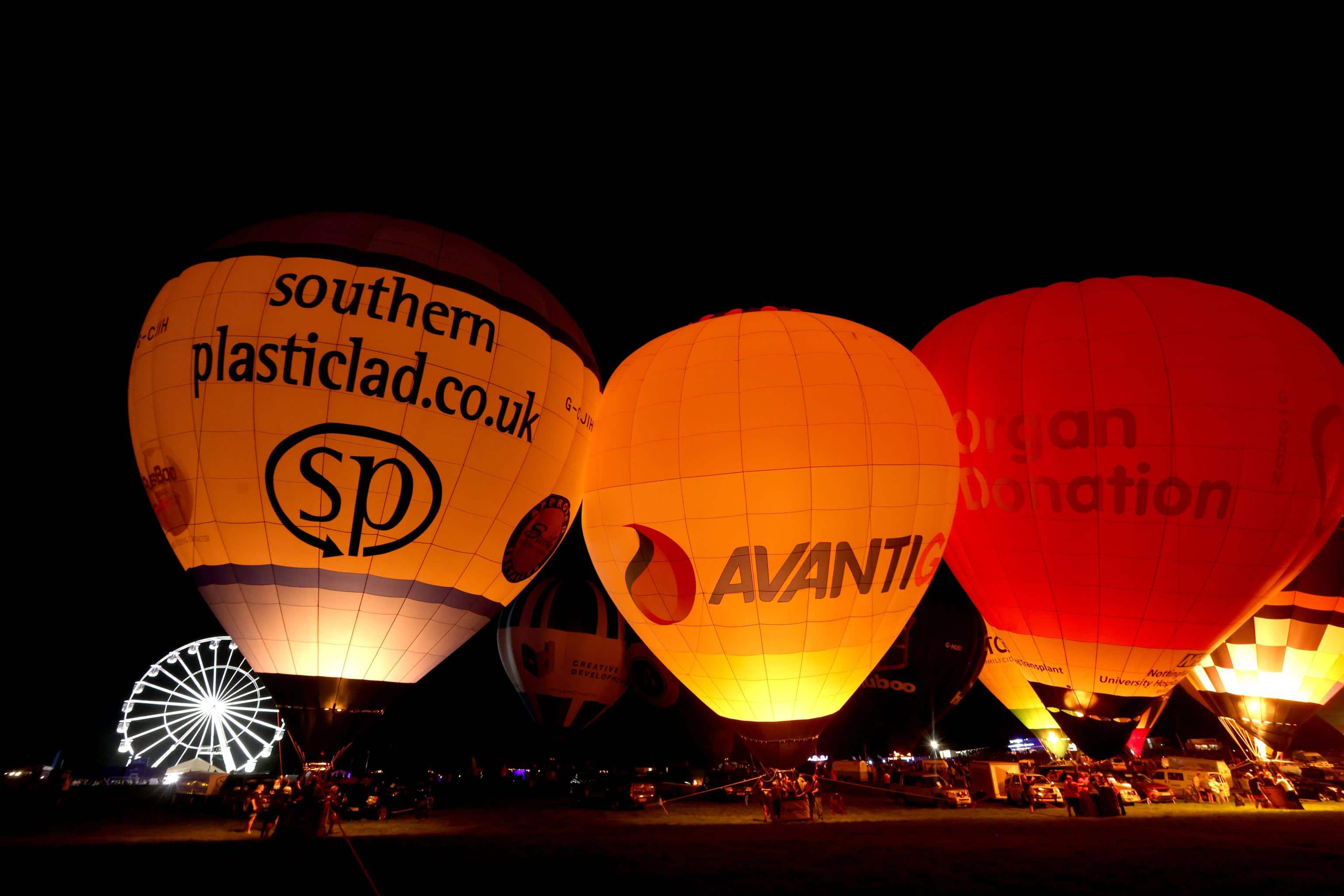 epa10794089 Hot Air Balloons use their burners during the Bristol International Balloon Fiesta, in Bristol, Britain, 10 August 2023. The four-day event with over 100 hot air balloons expected to participate runs from 10 to 13 August 2023.  EPA/NEIL HALL