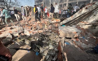 epa12171151 The site of a plane crash near Sardar Vallabhbhai Patel International Airport in Ahmedabad, Gujarat, western India, 12 June 2025. Air India flight AI171, bound for London carrying 242 passengers and crew members on board a Boeing 787-8 aircraft, crashed minutes after take-off in the Meghaninagar area of Ahmedabad.  EPA/SIDDHARAJ SOLANKI 88168