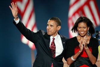 CHICAGO - NOVEMBER 04:  U.S. President elect Barack Obama and his wife Michelle acknowledge their supporters after Obama gave his victory speech during an election night gathering in Grant Park on November 4, 2008 in Chicago, Illinois. Obama defeated Republican nominee Sen. John McCain (R-AZ) by a wide margin in the election to become the first African-American U.S. President elect.  (Photo by Scott Olson/Getty Images)