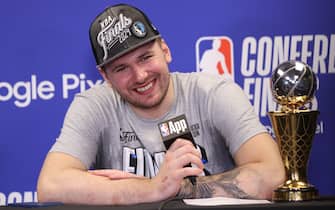 MINNEAPOLIS, MN - MAY 30: Luka Doncic #77 of the Dallas Mavericks speaks during a press conference after winning the Earvin "Magic" Johnson Trophy for the NBA Western Conference Finals Most Valuable Player during Round 3 Game 5 of the 2024 NBA Playoffs on May 30, 2024 at Target Center in Minneapolis, Minnesota. NOTE TO USER: User expressly acknowledges and agrees that, by downloading and or using this Photograph, user is consenting to the terms and conditions of the Getty Images License Agreement. Mandatory Copyright Notice: Copyright 2024 NBAE (Photo by Joe Murphy/NBAE via Getty Images)