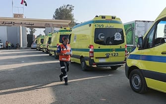 RAFAH, GAZA - NOVEMBER 01: Ambulances from Egypt pass through Rafah border crossing to transport seriously wounded Palestinians after Israeli attacks in Rafah, Gaza on November 01, 2023. (Photo by Stringer/Anadolu via Getty Images)