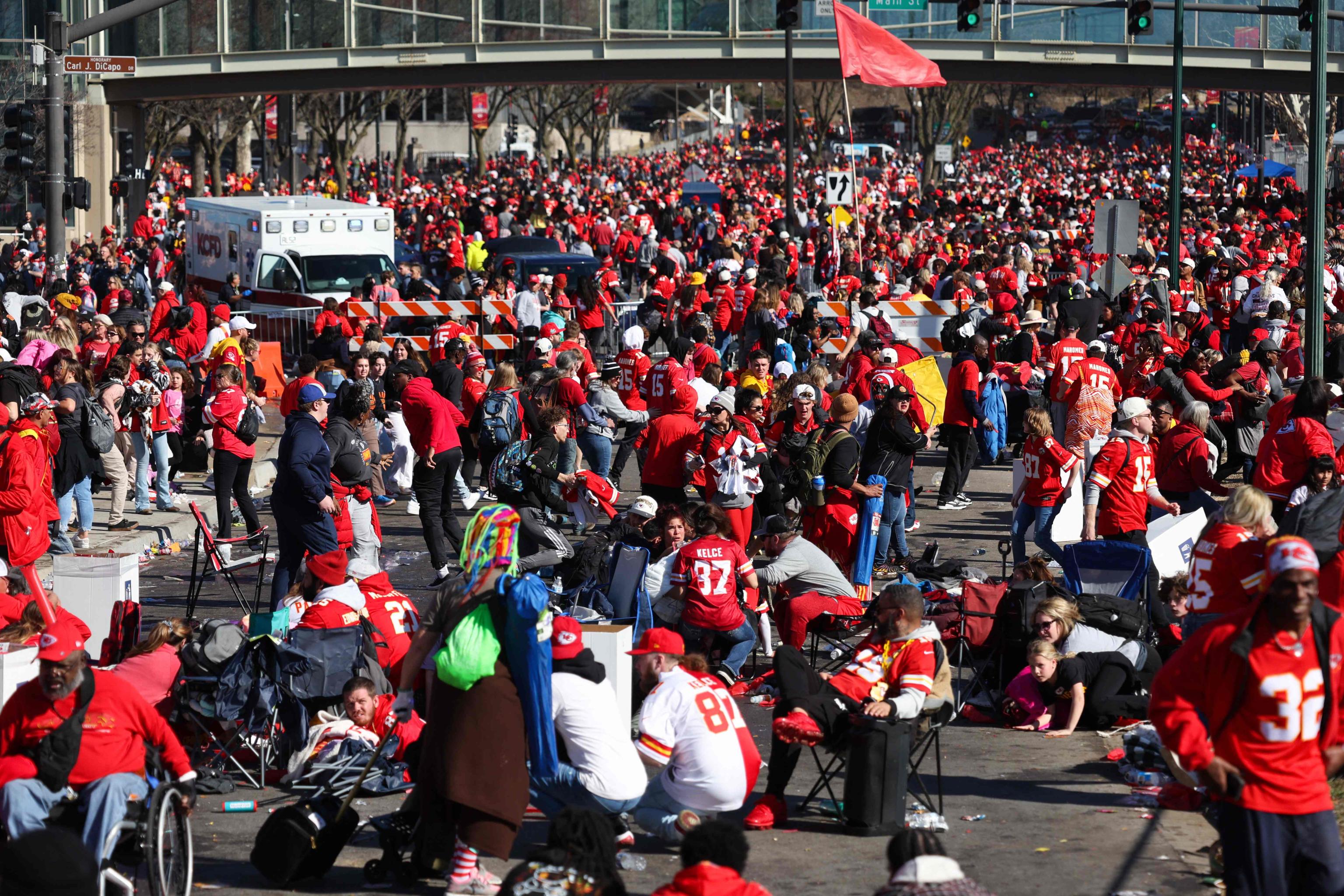 KANSAS CITY, MISSOURI - FEBRUARY 14: People take cover during a shooting at Union Station during the Kansas City Chiefs Super Bowl LVIII victory parade on February 14, 2024 in Kansas City, Missouri. Several people were shot and two people were detained after a rally celebrating the Chiefs Super Bowl victory.   Jamie Squire/Getty Images/AFP (Photo by JAMIE SQUIRE / GETTY IMAGES NORTH AMERICA / Getty Images via AFP)