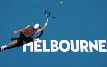 MELBOURNE, AUSTRALIA - JANUARY 14: Jannik Sinner of Italy plays a forehand in their round one singles match against Botic van de Zandschulp of the Netherlands during day one of the 2024 Australian Open at Melbourne Park on January 14, 2024 in Melbourne, Australia. (Photo by Julian Finney/Getty Images)