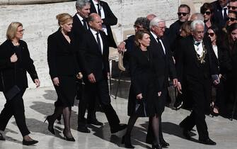 VATICAN CITY, VATICAN - APRIL 26: Germany's President Frank-Walter Steinmeier (R) and Germany's outgoing chancellor Olaf Scholz (C) arrive at the funeral of Pope Francis in St. Peter's Square on April 26, 2025 in Vatican City, Vatican. (Photo by Jakub Porzycki/Anadolu via Getty Images)