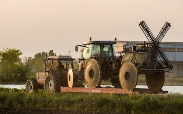 Rice fields agricolture tractor, Alto vercellese, Piedmont, Italy