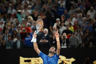 epa10438072 Novak Djokovic of Serbia celebrates after winning the Men s Singles Final against Stefanos Tsitsipas of Greece at the 2023 Australian Open tennis tournament in Melbourne, Australia, 29 January 2023.  EPA/JOEL CARRETT AUSTRALIA AND NEW ZEALAND OUT