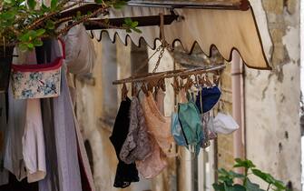 NAPLES, CAMPANIA, ITALY - 2020/05/22: Protective masks and women's underwear are hung out to dry on a balcony of a house in the center of Naples. (Photo by salvatore Laporta/KONTROLAB/LightRocket via Getty Images)