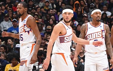 LOS ANGELES, CA - JANUARY 8: Kevin Durant #35, Devin Booker #1, and Bradley Beal #3 of the Phoenix Suns look on during the game against the LA Clippers on January 8, 2024 at Crypto.Com Arena in Los Angeles, California. NOTE TO USER: User expressly acknowledges and agrees that, by downloading and/or using this Photograph, user is consenting to the terms and conditions of the Getty Images License Agreement. Mandatory Copyright Notice: Copyright 2024 NBAE (Photo by Andrew D. Bernstein/NBAE via Getty Images)