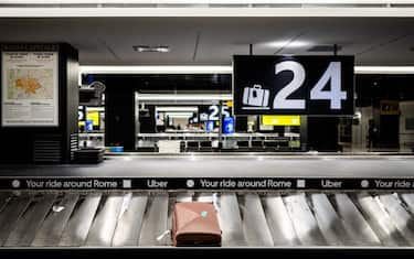 Baggage on a conveyor belt on arrival at Roma Fiumicino Leonardo Da Vinci airport in Rome in Lazio region in Italy on April 12, 2024. (Photo by Jc Milhet / Hans Lucas / Hans Lucas via AFP) (Photo by JC MILHET/Hans Lucas/AFP via Getty Images)