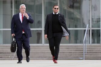 CENTRAL ISLIP, NEW YORK - OCTOBER 27: U.S. Representative George Santos (R-NY) walks out of a federal courthouse in Long Island with his lawyer Joe Murray on October 27, 2023 in Central Islip, New York. Santos pleaded not guilty to several new fraud charges in the indictment brought against him. (Photo by Spencer Platt/Getty Images)