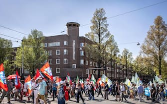 epa12067336 People take part in the annual May 1 march on International Workers' Day in Amsterdam, the Netherlands, 01 May 2025. Labor Day, or May Day, is observed worldwide on 01 May to celebrate the economic and social achievements of workers as well as fight for laborers' rights.  EPA/DINGENA MOL