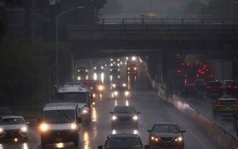 epa10890583 Drivers negotiate wet roads during heavy rain that caused widespread flooding in the Queens borough of New York, New York, USA, 29 September 2023.  EPA/JUSTIN LANE