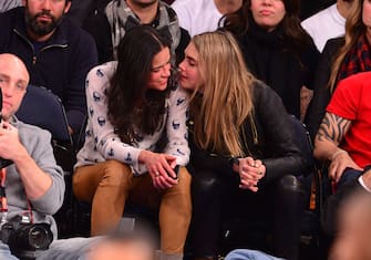 NEW YORK, NY - JANUARY 07:  Michelle Rodriguez and Cara Delevingne attend the Detroit Pistons vs New York Knicks game at Madison Square Garden on January 7, 2014 in New York City.  (Photo by James Devaney/WireImage)