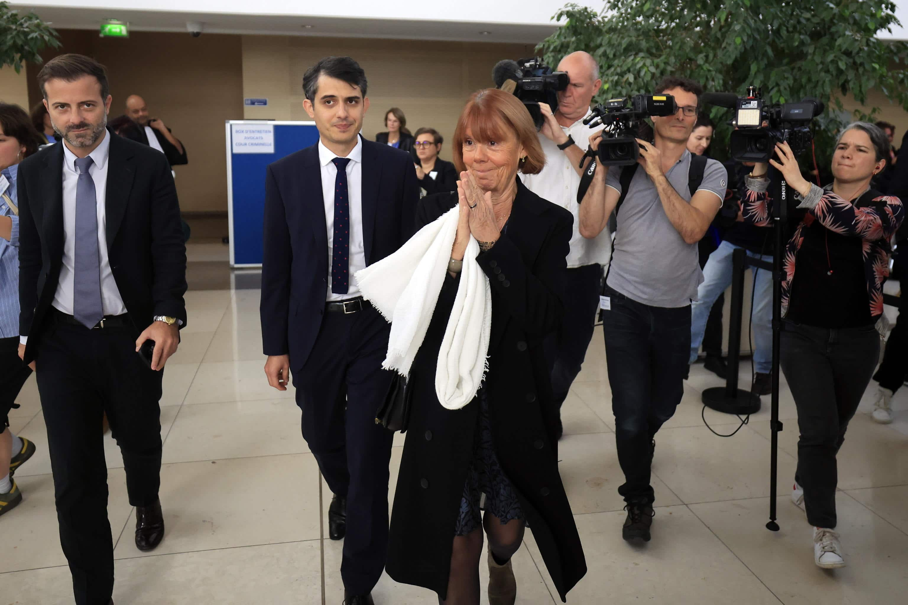 epaselect epa11677040 Gisele Pelicot (C), escorted by her lawyers Stephane Babonneau (2-L) and Antoine Camus (L), leaves the criminal court in Avignon, France, 23 October 2024, where her ex-husband stands trial. Dominique Pelicot is accused of drugging and raping his then-wife Gisele Pelicot. He is also accused of inviting dozens of men to rape her while she was unconscious at their home in Mazan, France, between 2011 and 2020. Fifty other men are facing trial for their alleged involvement. Dominique Pelicot could face a maximum sentence of 20 years in prison if convicted.  EPA/GUILLAUME HORCAJUELO