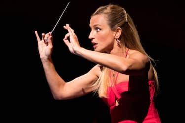 MILAN, ITALY - OCTOBER 14: Beatrice Venezi performs on stage during "Gianni Schicchi - Suor Angelica" on October 14, 2021 in Milan, Italy. (Photo by Jacopo Raule/Getty Images)