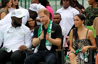 ABUJA, NIREGIA - MAY 11: Britain's Prince Harry (C), Duke of Sussex, and Britain's Meghan (R), Duchess of Sussex, attend an exhibition sitting volleyball match at Nigeria Unconquered, a community-based charitable organization dedicated to aiding wounded, injured, or sick servicemembers, as part of celebrations of Invictus Games anniversary in Abuja, Nigeria on May 11, 2024. (Photo by Emmanuel Osodi/Anadolu via Getty Images)