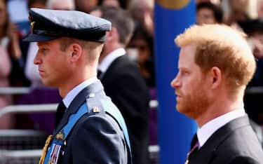 The Prince of Wales and Duke of Sussex follow the coffin of Queen Elizabeth II, draped in the Royal Standard with the Imperial State Crown placed on top, as it is carried on a horse-drawn gun carriage of the King's Troop Royal Horse Artillery, during the ceremonial procession from Buckingham Palace to Westminster Hall, London, where it will lie in state ahead of her funeral on Monday. Picture date: Wednesday September 14, 2022.