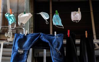 NAPLES, CAMPANIA, ITALY - 2020/05/28: Protective masks  are hung out to dry on a balcony of a house in the center of Naples. (Photo by Salvatore Laporta/KONTROLAB/LightRocket via Getty Images)