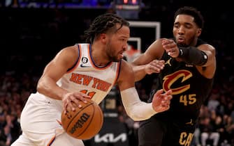 NEW YORK, NEW YORK - JANUARY 24:  Jalen Brunson #11 of the New York Knicks heads for the net as Donovan Mitchell #45 of the Cleveland Cavaliers defends in the third quarter at Madison Square Garden on January 24, 2023 in New York City. NOTE TO USER: User expressly acknowledges and agrees that, by downloading and or using this photograph, User is consenting to the terms and conditions of the Getty Images License Agreement. (Photo by Elsa/Getty Images)