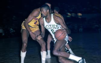BOSTON, MA - 1964: Bill Russell #6 of the Boston Celtics handles the ball against the San Francisco Warriors circa 1964 at the Boston Garden in Boston, Massachusetts. NOTE TO USER: User expressly acknowledges and agrees that, by downloading and/or using this photograph, user is consenting to the terms and conditions of the Getty Images License Agreement. Mandatory Copyright Notice: Copyright 1964 NBAE (Photo by Dick Raphael/NBAE via Getty Images)