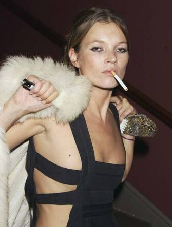 LONDON - JANUARY 30:  Kate Moss attends the Mario Testino Exhibition at The National Portrait Gallery on January 30, 2002 in London. (Photo by Dave Benett/Getty Images) *** Local Caption *** Kate Moss