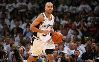 SAN ANTONIO - JUNE 7:  Tony Parker #9 of the San Antonio Spurs brings the ball up court against the Cleveland Cavaliers in Game One of the NBA Finals at the AT&T Center on June 7, 2007 in San Antonio, Texas. NOTE TO USER: User expressly acknowledges and agrees that, by downloading and/or using this Photograph, user is consenting to the terms and conditions of the Getty Images License Agreement. Mandatory Copyright Notice: Copyright 2007 NBAE (Photo by Jesse D. Garrabrant/NBAE via Getty Images)